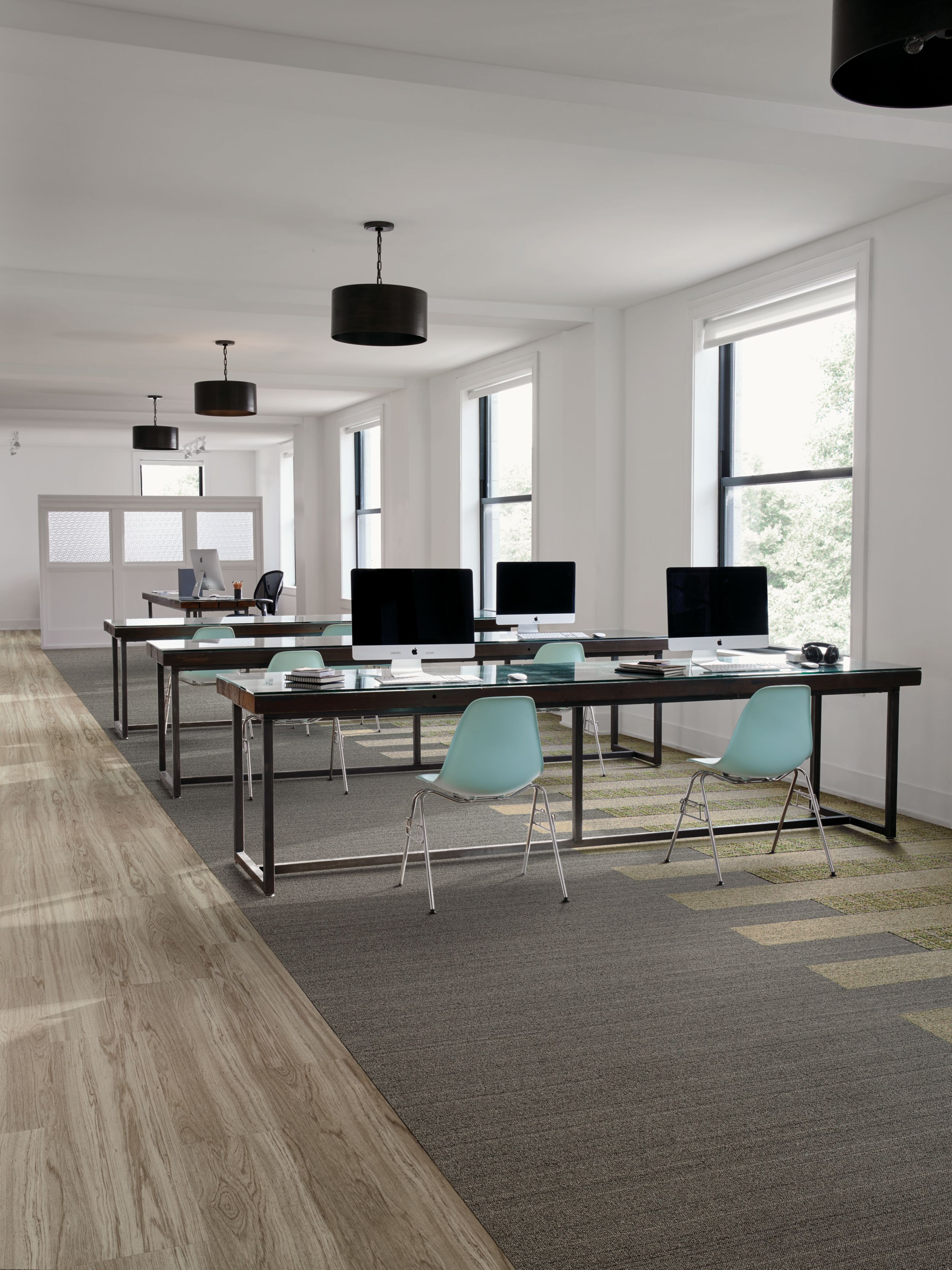 Interface WW860 and WW895 plank carpet tile in open work area with teal chairs image number 3